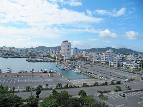 a view of a city with a harbor and buildings at Hotel Tulip Ishigakijima in Ishigaki Island