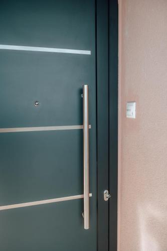 a close up of a refrigerator next to a door at Serenity Hill in Veria