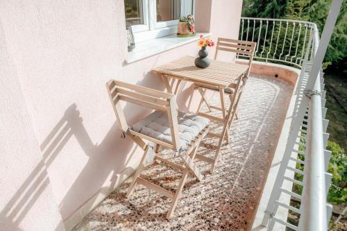 two chairs and a table on a balcony at Serenity Hill in Veria