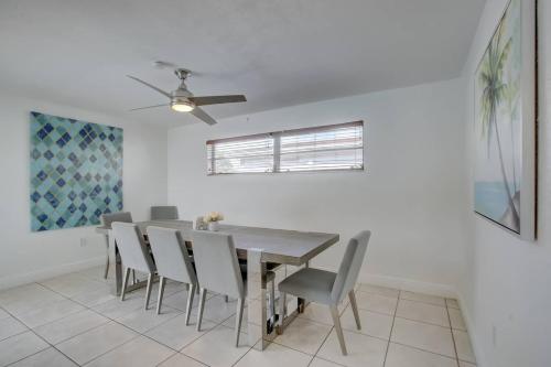 a dining room with a table and chairs at Sunrise Family Oasis Pool Lake Canal Views in Sunrise