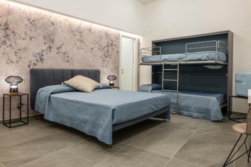 a bedroom with two bunk beds at Il Castelluccio Scafati in Scafati