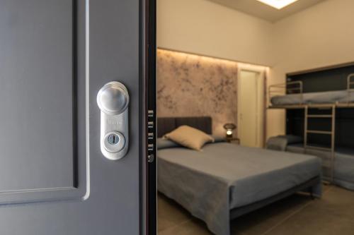 a room with a bedroom with a bed and a mirror at Il Castelluccio Scafati in Scafati