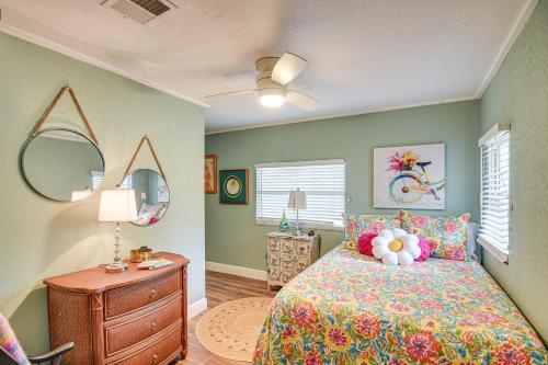 a bedroom with a bed and a dresser and mirror at Walk to Historic Dtwn Sanford Home with Gas Grill! in Sanford