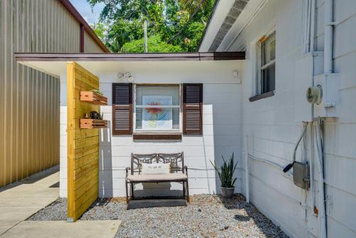 a door to a house with a bench in it at Walk to Historic Dtwn Sanford Home with Gas Grill! in Sanford