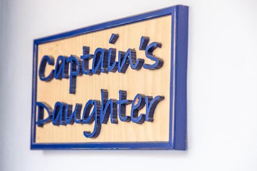 a sign with the words congratulations daughter in blue at Captain Hook in Hydra