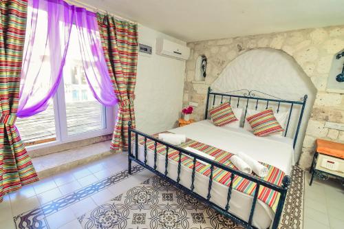 Cama o camas de una habitación en Rüzgargülü Otel