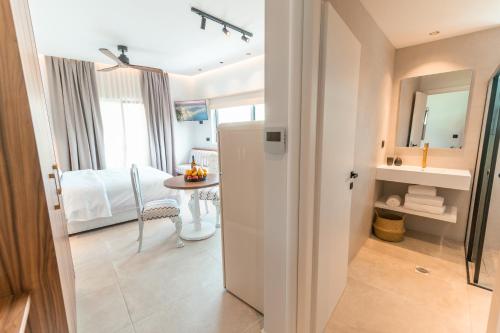 a room with a kitchen and a dining room at Granny's House in Kos Town