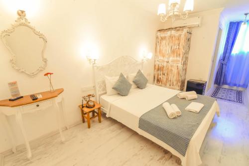 Cama o camas de una habitación en Rüzgargülü Otel