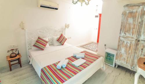 Cama o camas de una habitación en Rüzgargülü Otel