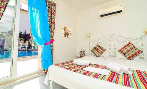 Cama o camas de una habitación en Rüzgargülü Otel