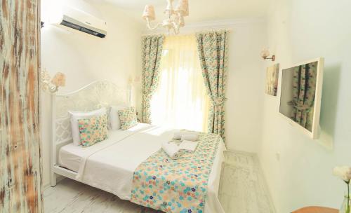 Cama o camas de una habitación en Rüzgargülü Otel