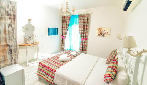 Cama o camas de una habitación en Rüzgargülü Otel