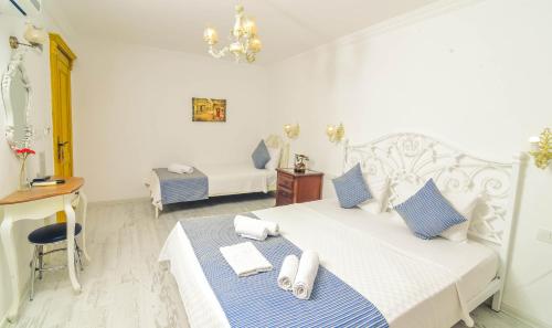 Cama o camas de una habitación en Rüzgargülü Otel