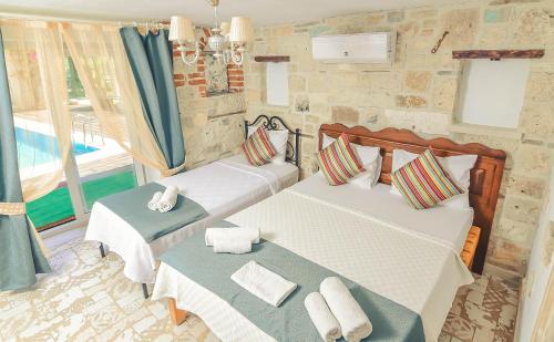 Cama o camas de una habitación en Rüzgargülü Otel