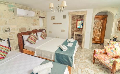 Cama o camas de una habitación en Rüzgargülü Otel