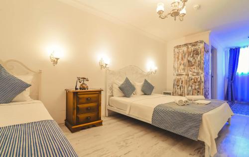 Cama o camas de una habitación en Rüzgargülü Otel