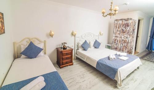 Cama o camas de una habitación en Rüzgargülü Otel
