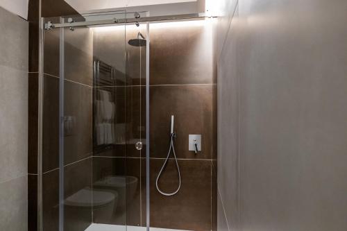 a bathroom with a glass shower with two toilets at Il Castelluccio Scafati in Scafati