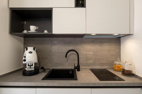 a kitchen sink with a hello kitty mixer on it at Il Castelluccio Scafati in Scafati