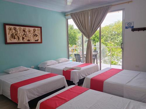 Ένα ή περισσότερα κρεβάτια σε δωμάτιο στο Hotel Inversiones Napoles