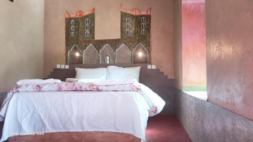 Ένα ή περισσότερα κρεβάτια σε δωμάτιο στο KASBAH IFRi