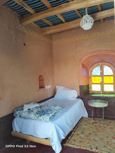 Ένα ή περισσότερα κρεβάτια σε δωμάτιο στο KASBAH IFRi