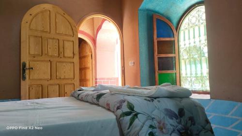 Ένα ή περισσότερα κρεβάτια σε δωμάτιο στο KASBAH IFRi