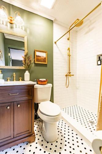 a bathroom with a toilet and a sink and a shower at The Green House - Central location PTC - Trilith in Tyrone