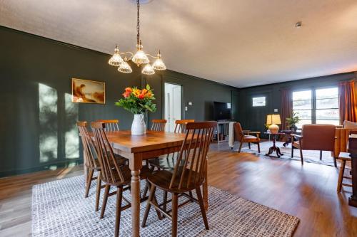 a dining room with a wooden table and chairs at The Green House - Central location PTC - Trilith in Tyrone