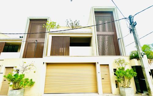 a building with two garage doors in front of it at villa by mount in Ratmalana