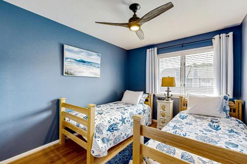 a bedroom with two beds and a ceiling fan at Westwood --- 828 Westwood Unit D in Bethany Beach