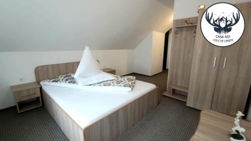 a bedroom with a bed with a shark head on it at Casa Adi in Moieciu de Sus