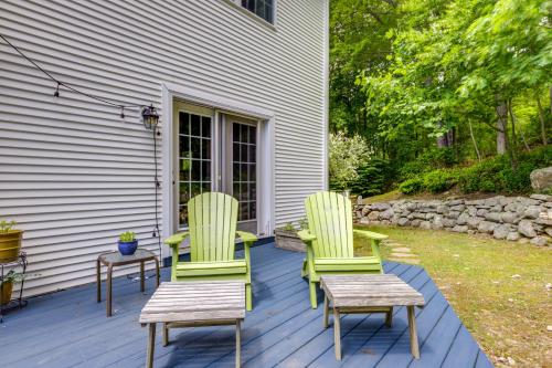 two chairs and a table on a deck at Mystic Retreat with Patio and Grill Walk to River! in Mystic