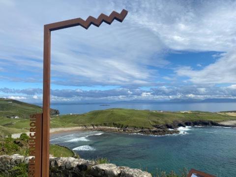 a view of a beach and the ocean at Memory Lane Self Catering Cottage in Muckros