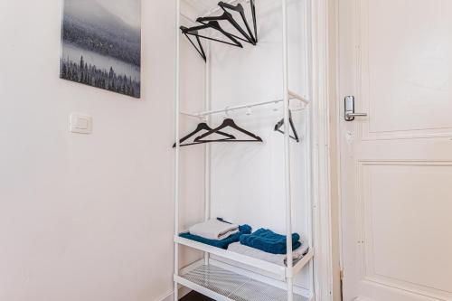 a room with a closet with a white door at Spacious Shared 5BR Apt in the Heart of Gent in Ghent