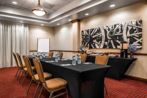 a conference room with a long table and chairs at Hyatt Place Fort Worth Stockyard in Fort Worth
