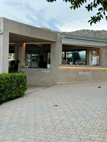 a building with the front of it at Psamathi Living & Taste in Marathi
