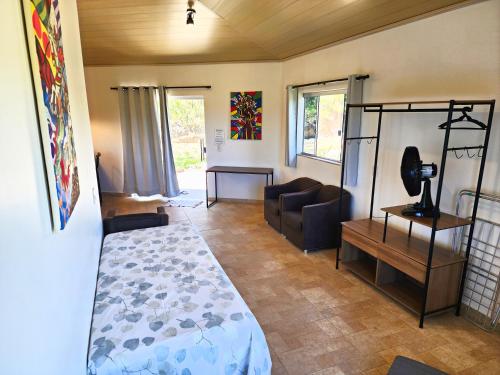 Postel nebo postele na pokoji v ubytování Bangalô São Jorge - Ecohospedagem Canto da Coruja