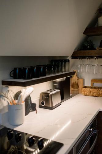 a kitchen with a counter with a toaster on it at A Frame of Mind in Dahlonega