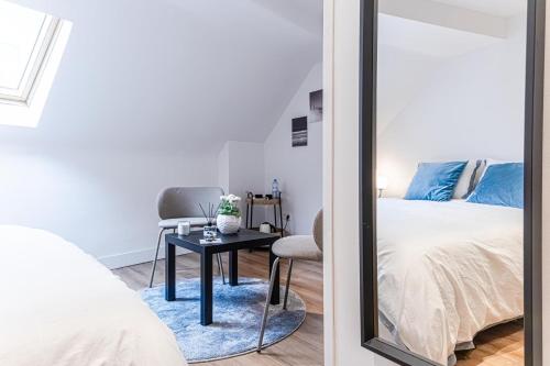 a bedroom with a bed and a mirror at Spacious Shared 5BR Apt in the Heart of Gent in Ghent