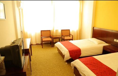 Huangshan Tangkou Haoshi International Youth Hostelにあるベッド