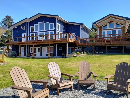 a house with two chairs and a deck at Leisure Suite - Homer Seaplane Base in Homer
