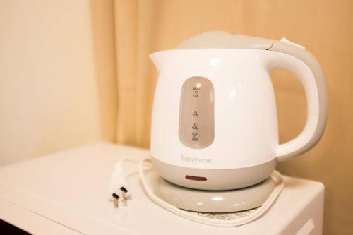 a white blender sitting on top of a counter at Miyanonoki Toji Kyoto in Kyoto