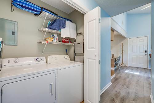 a laundry room with a washer and dryer at Amelia Island Condo with Pool Access Walk to Beach! in Fernandina Beach