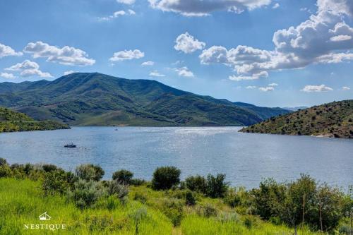 a view of a lake with mountains in the background at Private Weber Tributary Access Family Retreat in Morgan Hosted by Nestique in Morgan