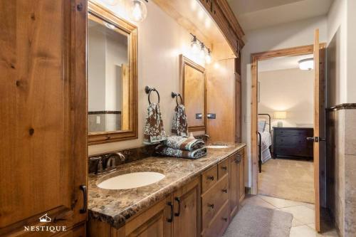 a bathroom with a sink and a mirror at Private Weber Tributary Access Family Retreat in Morgan Hosted by Nestique in Morgan