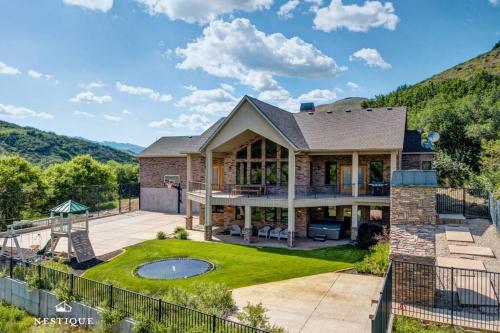 an aerial view of a house with a backyard at Private Weber Tributary Access Family Retreat in Morgan Hosted by Nestique in Morgan