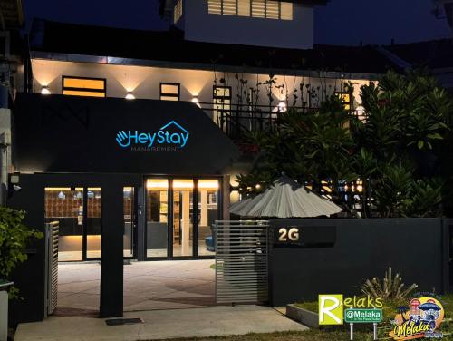a night view of aleystop sign in front of a building at Modern Cave Guest House Walking Distance 5Mins To Jonker in Melaka