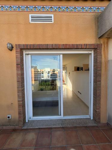 a sliding glass door with a view of a balcony at Miramar in Almazora