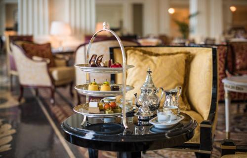 a tray of food on a table in a room at Palazzo Versace Dubai in Dubai